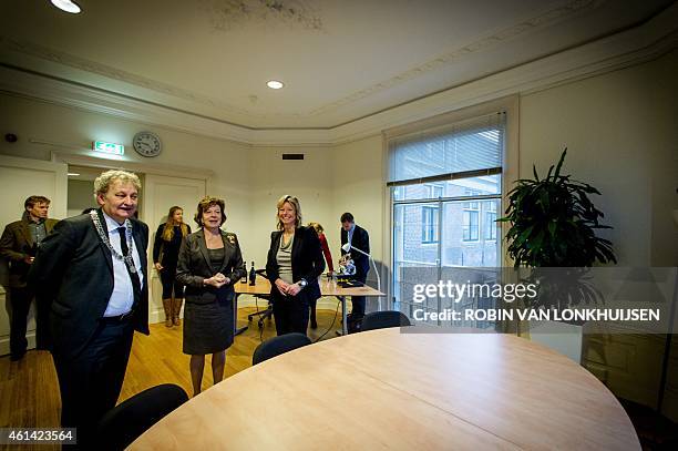 Dutch former European Commissioner for Digital Agenda Neelie Kroes is welcomed by mayor of Amsterdam Eberhard van der Laan and alderman Kajsa...