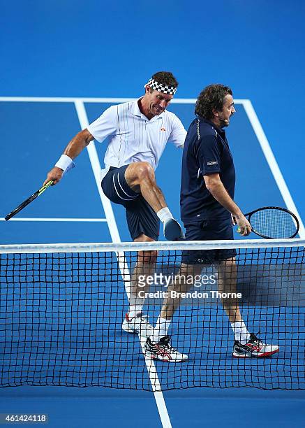Pat Cash of Australia and Henri Leconte of France share a joke during a Fast4 Legends tennis doubles exhibition match prior to the Roger Federer and...