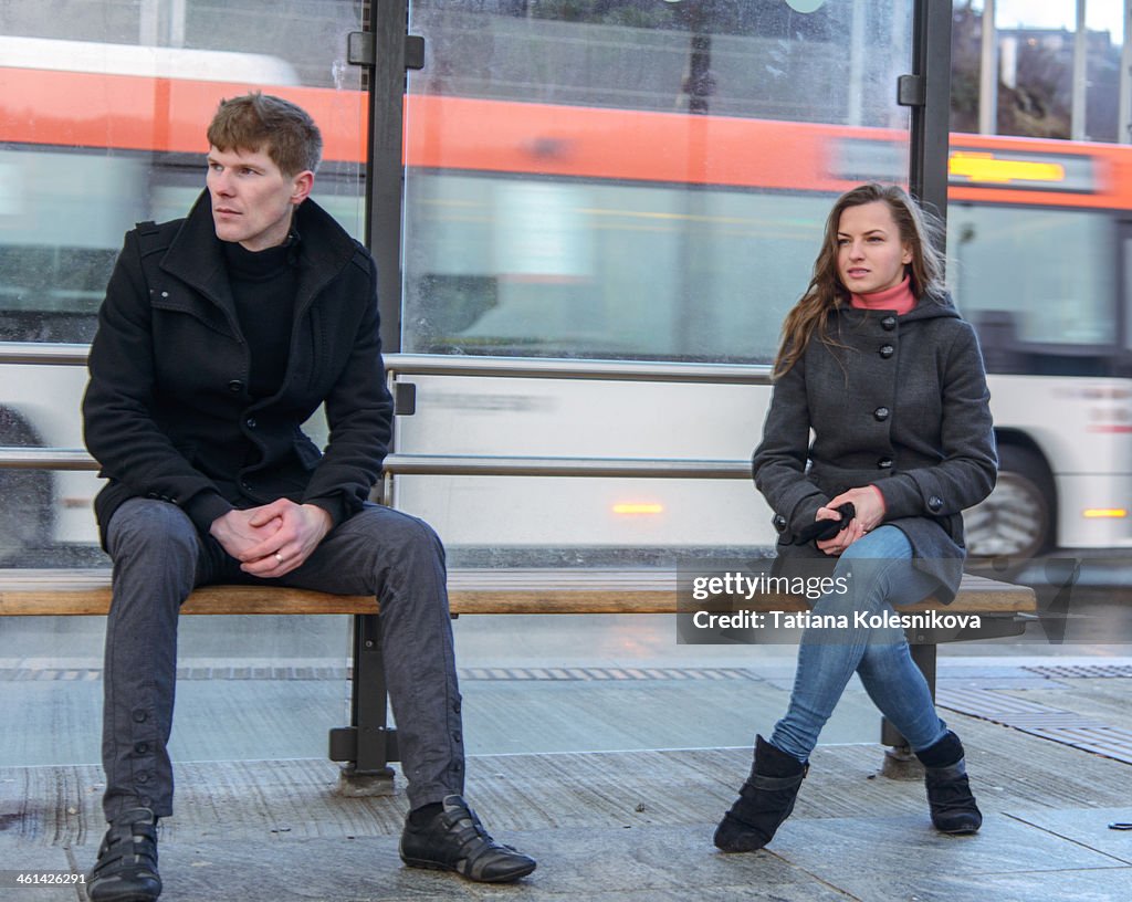 Woman waiting at bus station