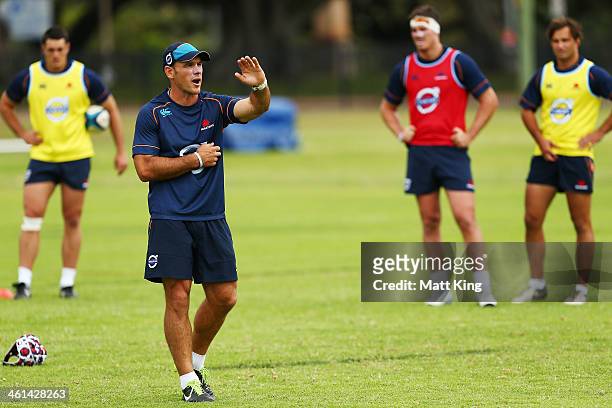 Waraths assistant coach Nathan Grey instructs players during a Waratahs Super Rugby training sesssion at Moore Park on January 9, 2014 in Sydney,...