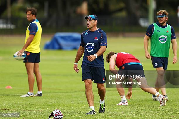 Waraths assistant coach Nathan Grey instructs players during a Waratahs Super Rugby training sesssion at Moore Park on January 9, 2014 in Sydney,...