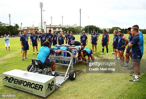 Waratahs coach Michael Cheika overlooks players packing down during a Waratahs Super Rugby training sesssion at Moore Park on January 9, 2014 in...