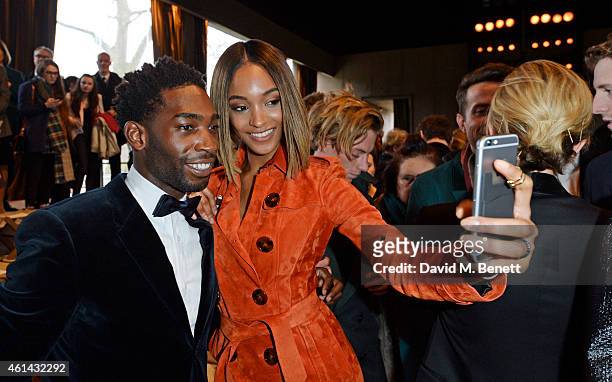 Tinie Tempah and Jourdan Dunn attend the front row at Burberry Prorsum AW15 London Collections: Men at Kensington Gardens on January 12, 2015 in...