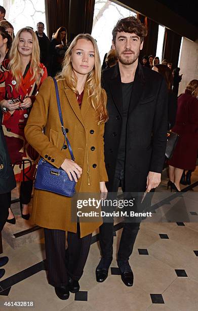 Immy Waterhouse and Robert Konjic attend the front row at Burberry Prorsum AW15 London Collections: Men at Kensington Gardens on January 12, 2015 in...