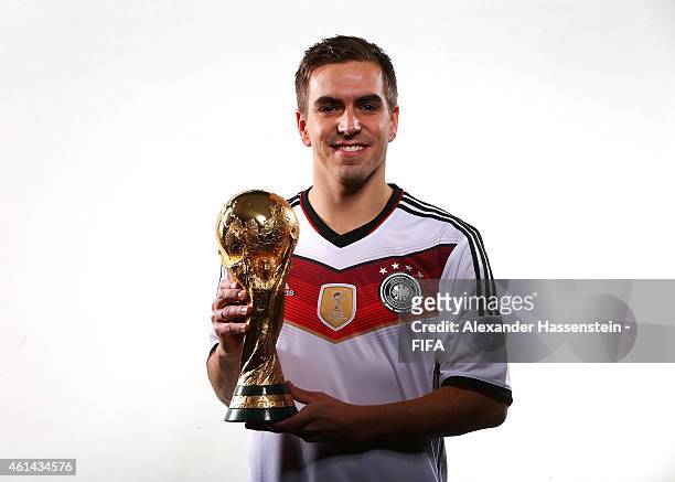 Philipp Lahm of Germany poses with the FIFA World Cup Trophy prior to the FIFA Ballon d'Or Gala 2014 at the Park Hyatt hotel on January 12, 2015 in...