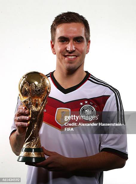 Philipp Lahm of Germany poses with the FIFA World Cup Trophy prior to the FIFA Ballon d'Or Gala 2014 at the Park Hyatt hotel on January 12, 2015 in...