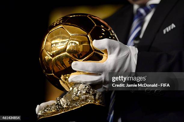 An official brings out the FIFA Ballon d'Or trophy before the nominees press conference for the FIFA Ballon d'Or 2014 prior to the FIFA Ballon d'Or...