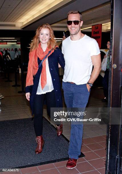 Kimberly Brook and James Van Der Beek are seen at Los Angeles International Airport on September 08, 2013 in Los Angeles, California.