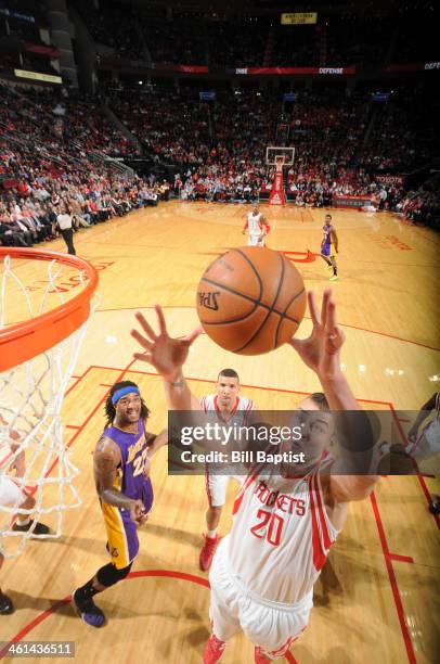 Donatas Motiejunas of the Houston Rockets rebounds against the Los Angeles Lakers on January 8, 2014 at the Toyota Center in Houston, Texas. NOTE TO...