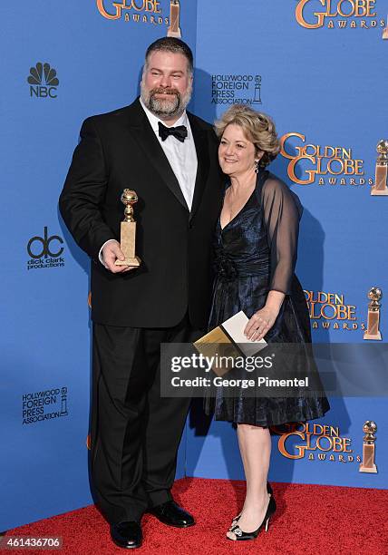 Writer/director Dean DeBlois and producer Bonnie Arnold, winners of Best Animated Feature Film for 'How to Train Your Dragon 2 pose in the press room...