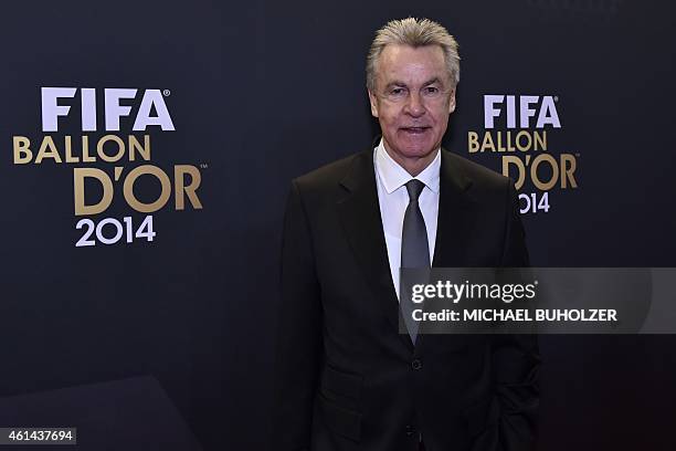 Switzerland's German coach Ottmar Hitzfeld poses as he arrives during the red carpet ceremony ahead of the 2014 FIFA Ballon d'Or award ceremony at...