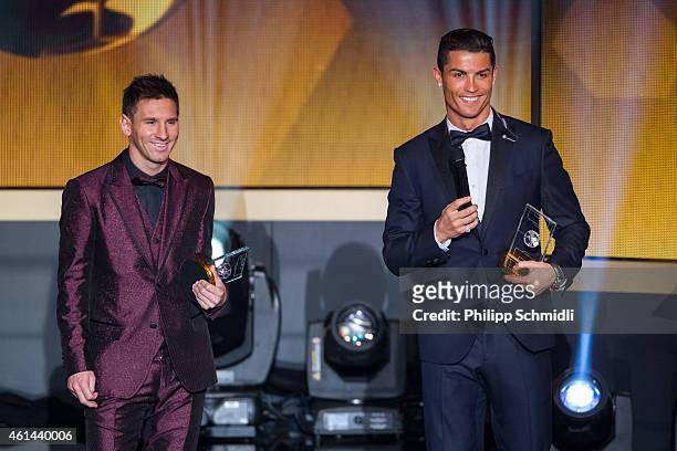 Ballon d'Or nominees Lionel Messi of Argentina and FC Barcelona and Cristiano Ronaldo of Portugal and Real Madrid smile during the FIFA Ballon d'Or...