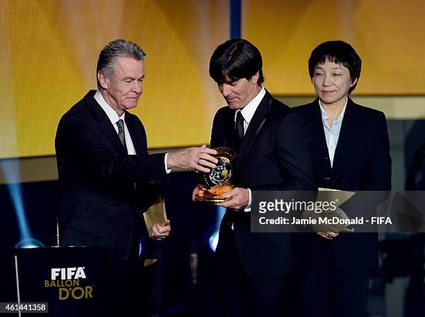 World Coach of the Year for Men's Football winner Joachim Loew of Germany receives his award from Ottmar Hitzfeld during the FIFA Ballon d'Or Gala...