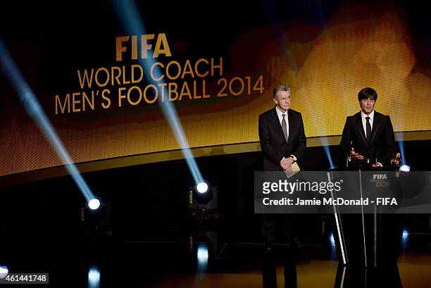 World Coach of the Year for Men's Football winner Joachim Loew of Germany receives his award from Ottmar Hitzfeld during the FIFA Ballon d'Or Gala...