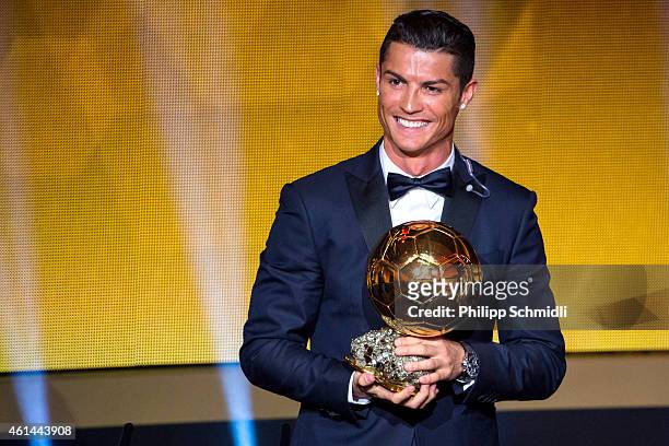 Cristiano Ronaldo of Portugal and Real Madrid receives the 2014 FIFA Ballon d'Or award for the player of the year during the FIFA Ballon d'Or Gala...
