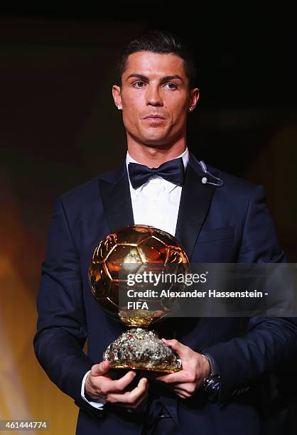 Ballon d'Or winner Cristiano Ronaldo of Portugal and Real Madrid poses with his award during the FIFA Ballon d'Or Gala 2014 at the Kongresshaus on...