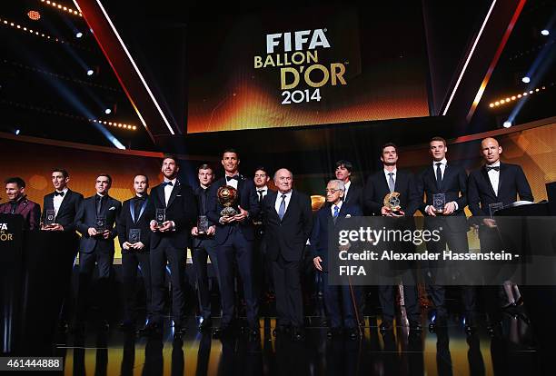 Ballon d'Or winner Cristiano Ronaldo of Portugal and Real Madrid and FIFA President Joseph S. Blatter are flanked by fellow award winners during the...