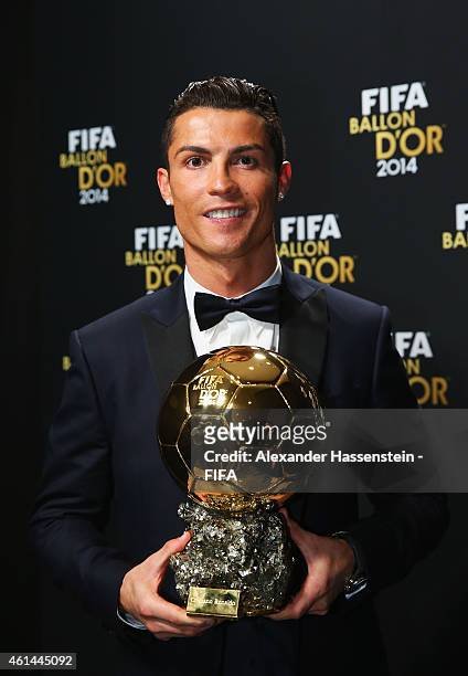 Ballon d'Or winner Cristiano Ronaldo of Portugal and Real Madrid poses with his award during the FIFA Ballon d'Or Gala 2014 at the Kongresshaus on...
