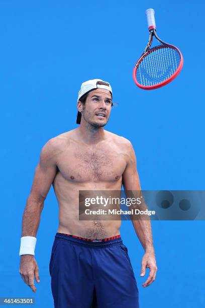 Tommy Haas of Germany throws his racquet in the air during his training session ahead of the 2014 Australian Open at Melbourne Park on January 9,...