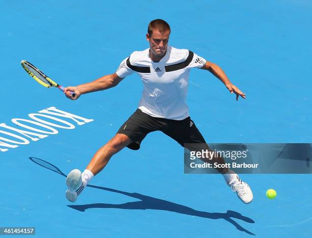 Mikhail Youzhny of Russia plays a forehand during his match against Jordan Thompson of Australia during day two of the AAMI Classic at Kooyong on...