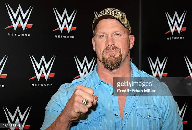 Actor and WWE personality "Stone Cold" Steve Austin appears at a news conference announcing the WWE Network at the 2014 International CES at the...