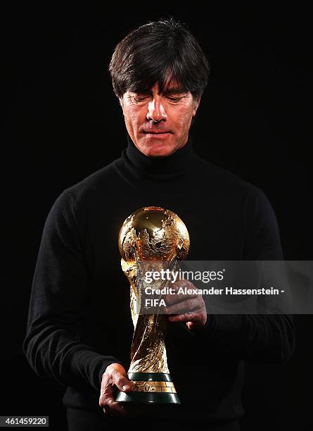 World Coach of the Year for Men's Football nominee Joachim Loew of Germany poses with the FIFA World Cup Trophy prior to the FIFA Ballon d'Or Gala...