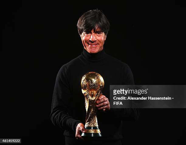 World Coach of the Year for Men's Football nominee Joachim Loew of Germany poses with the FIFA World Cup Trophy prior to the FIFA Ballon d'Or Gala...