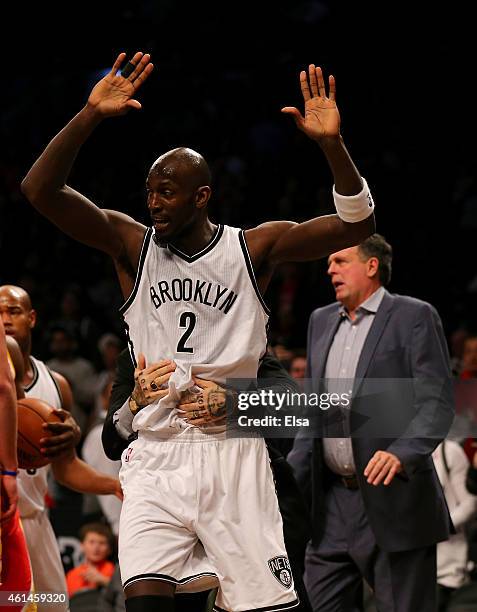 Kevin Garnett of the Brooklyn Nets breaks free from the hold after he and Dwight Howard of the Houston Rockets got into a scuffle in the first...