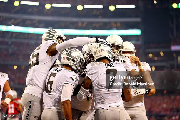 Wide receiver Keanon Lowe of the Oregon Ducks celebrates after catching a 7 yard touchdown thrown by quarterback Marcus Mariota in the first quarter...