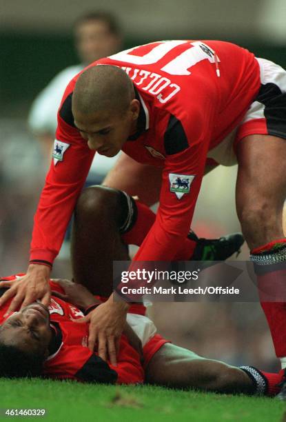 September 1994 FA Premiership - Tottenham Hotspur v Nottingham Forest, Stan Collymore checks on injured Forest colleague Bryan Roy.