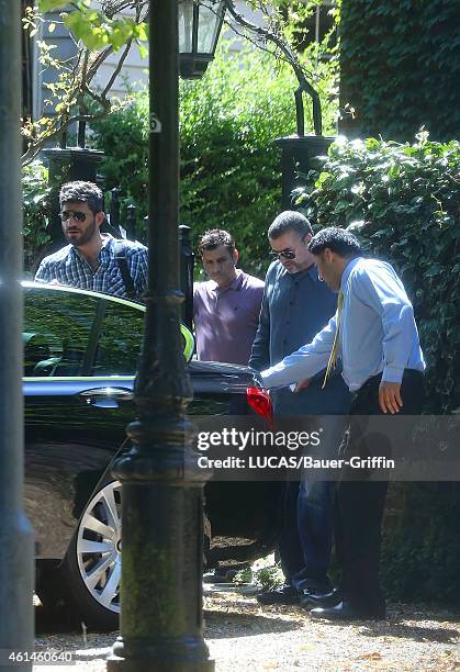 George Michael and his boyfriend Fadi Fawaz are seen on July 29, 2012 in London, United Kingdom.