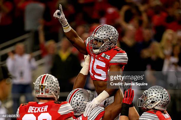 Running back Ezekiel Elliott of the Ohio State Buckeyes celebrates after scoring a 33 yard touchdown in the first quarter against the Oregon Ducks...
