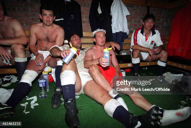 June 1994 International Rugby - South Africa v England - Tired England players relax in the dressing room after beating South Africa - l to r: Will...