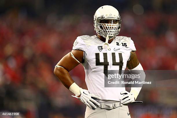 Defensive lineman DeForest Buckner of the Oregon Ducks looks on in the first half during the College Football Playoff National Championship Game at...