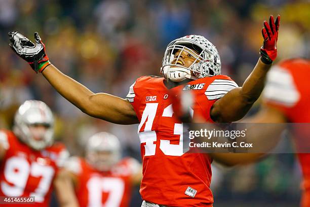 Linebacker Darron Lee of the Ohio State Buckeyes celebrates a play in the fourth quarter against the Oregon Ducks during the College Football Playoff...