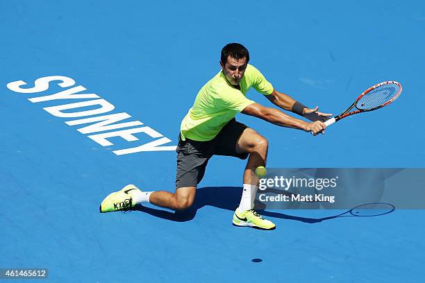 Bernard Tomic of Australia plays a plays a backhand in his match against Igor Sijsling of the Netherlands during day three of the Sydney...