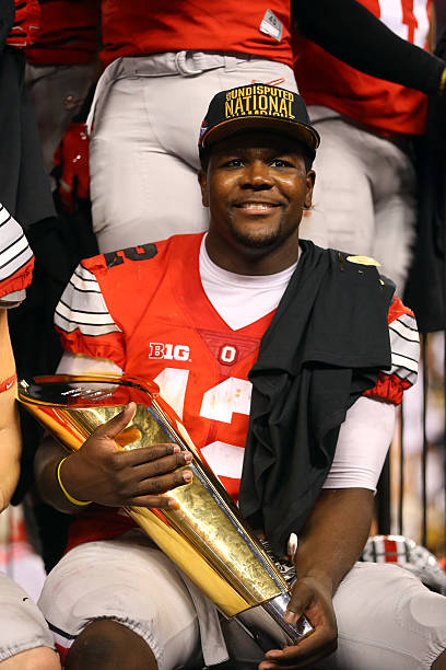 Quarterback Cardale Jones of the Ohio State Buckeyes celebrates after defeating the Oregon Ducks 42 to 20 in the College Football Playoff National...