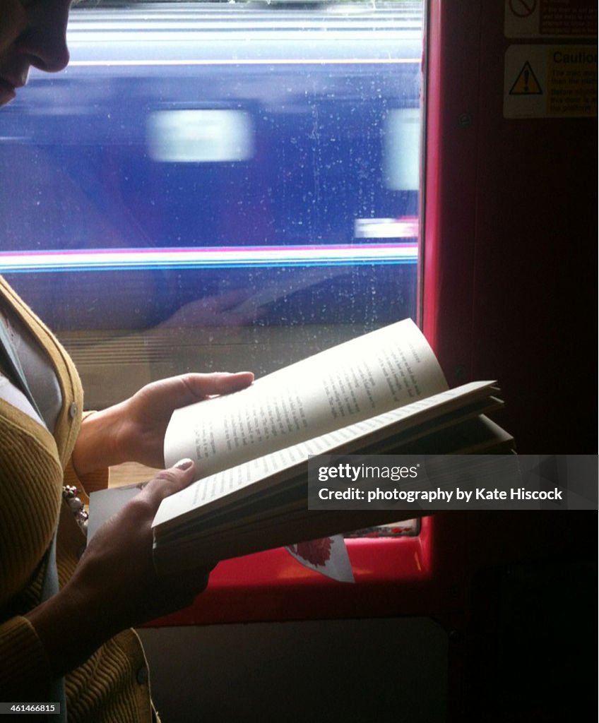 Woman reading on the train