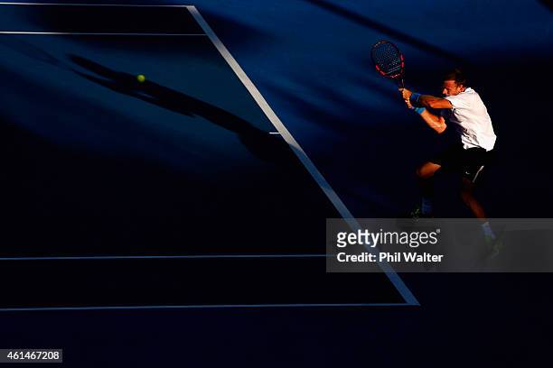 Michael Venus of New Zealand plays a backhand in his singles match against Alejandro Gonzalez of Colombia during day two of the 2015 Heineken Open...