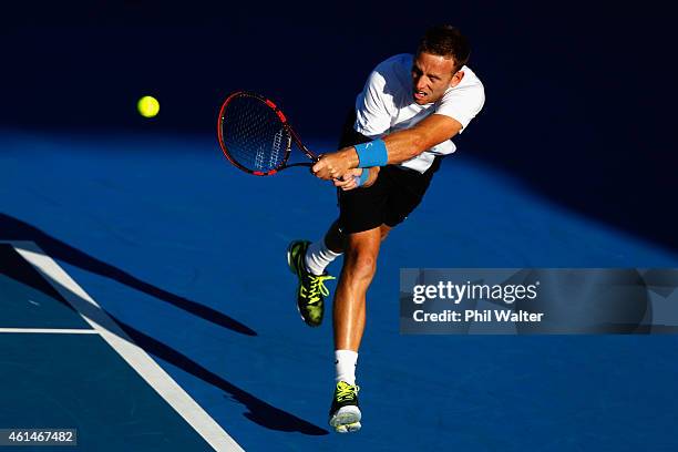 Michael Venus of New Zealand plays a backhand in his singles match against Alejandro Gonzalez of Colombia during day two of the 2015 Heineken Open...