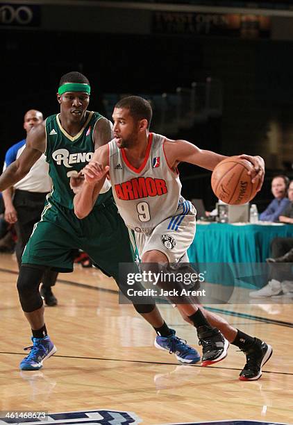 Justin Johnson of the Springfield Armor dribbles against the Reno Bighorns during the 2014 NBA D-League Showcase presented by Samsung Galaxy on...