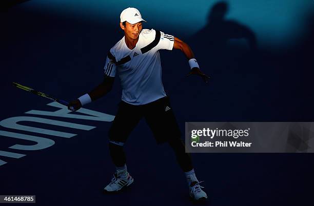 Yen-Hsun Lu of Chinese Taipei plays a forehand against Steve Johnson of the USA during day four of the Heineken Open at ASB Tennis Centre on January...