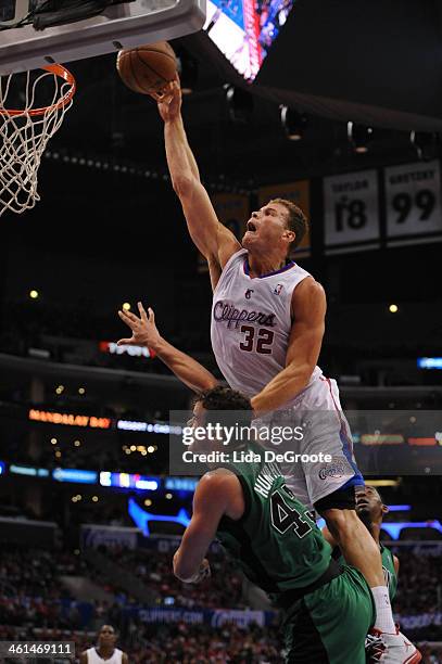 Blake Griffin of the Los Angeles Clippers dunks over Kris Humphries of the Boston Celtics at Staples Center on January 8, 2014 in Los Angeles,...