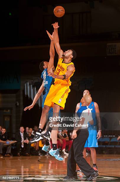 Tony Mitchell of the Fort Wayne Mad Ants tips off the game against Maurice Sutton of the Tulsa 66ers during the 2014 NBA D-League Showcase on January...