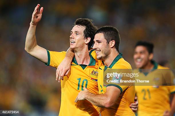 Robbie Kruse of Australia celebrates with team mate Mathew Leckie after scoring a goal during the 2015 Asian Cup match between Oman and Australia at...