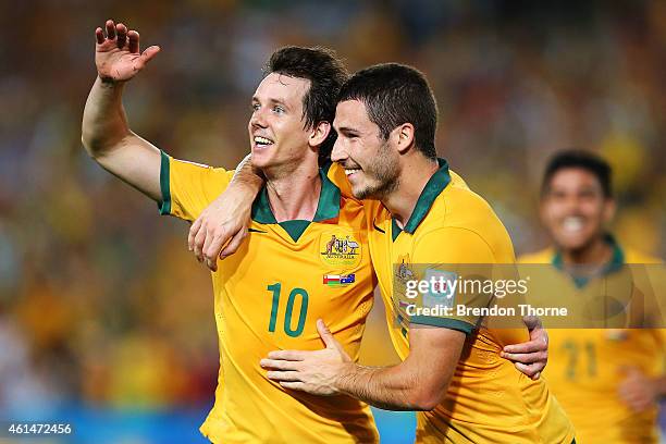 Robbie Kruse of Australia celebrates with team mate Mathew Leckie after scoring a goal during the 2015 Asian Cup match between Oman and Australia at...