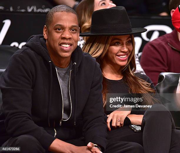 Jay-Z and Beyonce Knowles attend the Houston Rockets vs Brooklyn Nets game at Barclays Center on January 12, 2015 in New York City.