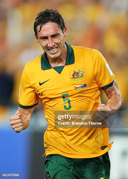 Mark Milligan of Australia celebrates after scoring a goal during the 2015 Asian Cup match between Oman and Australia at ANZ Stadium on January 13,...