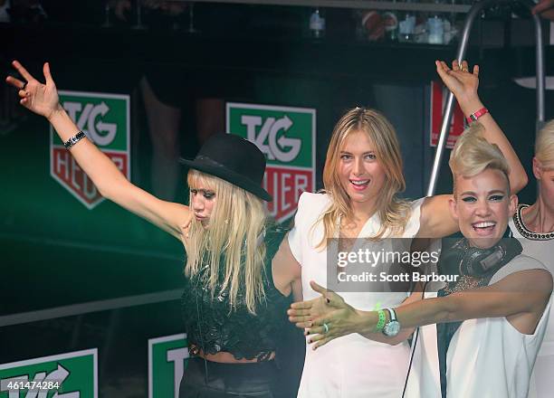 Maria Sharapova helps as Miriam Nervo and Olivia Nervo of NERVO DJ as they attend the TAG Heuer Party at Ms Collins on January 13, 2015 in Melbourne,...