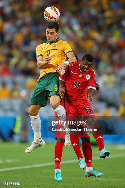 Tomi Juric of Australia competes with Amer Said Al-Shatri of Oman during the 2015 Asian Cup match between Oman and Australia at ANZ Stadium on...